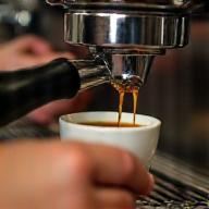 Barista pouring espresso